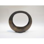 A studio pottery flower basket or Ikebana of hooped form, blackened glaze.