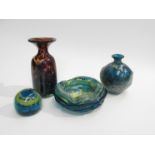 Four Mdina Glass items including tortoiseshell vase, blue and ochre vase, paperweight and bowl.