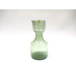 A Gullaskruf carafe by Kjell Blomberg in green glass. Label remains to top.