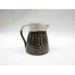 LAURA HURSTON (XX/XXI) A sgraffito stoneware jug. 14cm high.