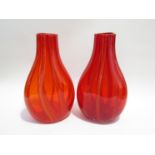 A pair of art glass vases in red with vertical stripe detail 34.5 cm high.