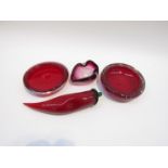 A collection of art glass in ruby colours including Whitefriars dishes and a modern glass chilli