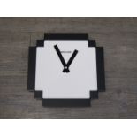 A GeekCook black and white wall clock,