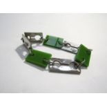 A 1960's "Celebrity New York" bracelet in the form of razor blades in sliver plated metal and green