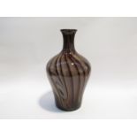 A large art glass vase in amethyst and cream swirls and stripes. 39.5cm high.