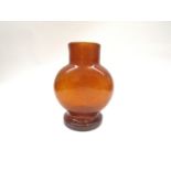 A Scandinavian glass vase in amber coloured soda glass, in the style of Eric Hoglund.