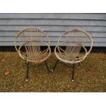 A pair of 1950's hoop cane chairs on tubular metal bases by Rohe Noorwolde. Cane alf