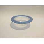 A Christopher Williams Glasshouse bowl, clear with an iridescent blue rim,