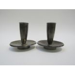 A pair of Georg Jensen Danish pewter candlesticks. Marks to base and No 2690.