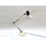 A white anglepoise desk lamp with adjustable single spot,