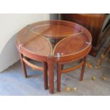 A Nathan furniture teak and glass nest of tables,