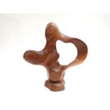 A carved wooden sculpture of free form set on a plinth, marked with TR monogram.