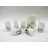 A lemonade set in white glass with coloured swirl detail,