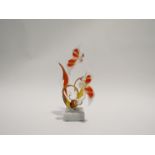 A Murano sculptural glass pair of birds on foliage, mounted onto a marble square base. 20.