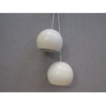 A pair of Danish white globe pendant lights