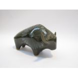 A lotus pottery figure of a bull, green glazed.