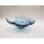 A blue cased art glass bowl with cut out rim and pulled detail, 12cm high x 34.