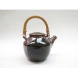 MICHAEL CASSON (1925-2003): An early Ross on Wye Studio Pottery lidded teapot, cane handle.