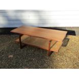 A G-Plan teak coffee table with woven split cane undertier, 'Long John' model c1978 designed by R.A.