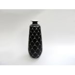 A Norwegian Pottery tall vase, tapered with flared lip, black glazed with white tubeline detail.