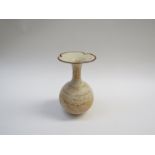 An ash glazed pottery stoneware vase. A pot bellied bottle form, flared out into a cloverleaf rim.