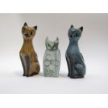 Two Guernsey pottery figures of cats and one Carn Pottery cat, tallest 18.