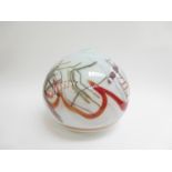 A Daniel Elder studio art glass spherical vase in white with coloured random line detail,