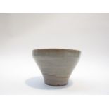 A Studio Pottery bowl, thin Celedon glaze. Incised R S to base.