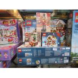 Seven boxed Lego Christmas themed sets to include 10249 Winter Toy Shop,