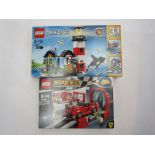 A boxed Lego Creator set 31051 Lighthouse and Lego Speed Champions set 75882 Ferrari FXX and