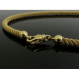 A gold fine woven twist necklace, stamped 750, 41cm long, 28.