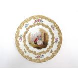 A Continental porcelain cabinet plate, painted central cartouche depicting a young couple,