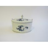 A Lowestoft porcelain blue and white painted oval butter tub with two lug handles and lid,