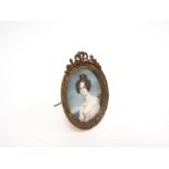 A 19th Century miniature on ivory oval panel of a young woman.