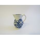A Lowestoft porcelain blue and white sparrow beak cream jug, printed with flowers.