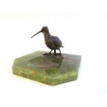 An onyx pin tray surmounted by a cold painted Snipe,