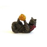 A bronze Franklin Mint figure of a cat playing with a ball of yellow wool