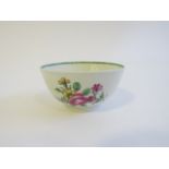 A Lowestoft porcelain late polychrome tea bowl painted with roses and summer flowers,