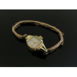 A Tudor lady's wristwatch, case stamped 14k on a 9ct gold expanding bracelet, 13.