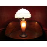 A mottled coloured glass table lamp with white glass shade