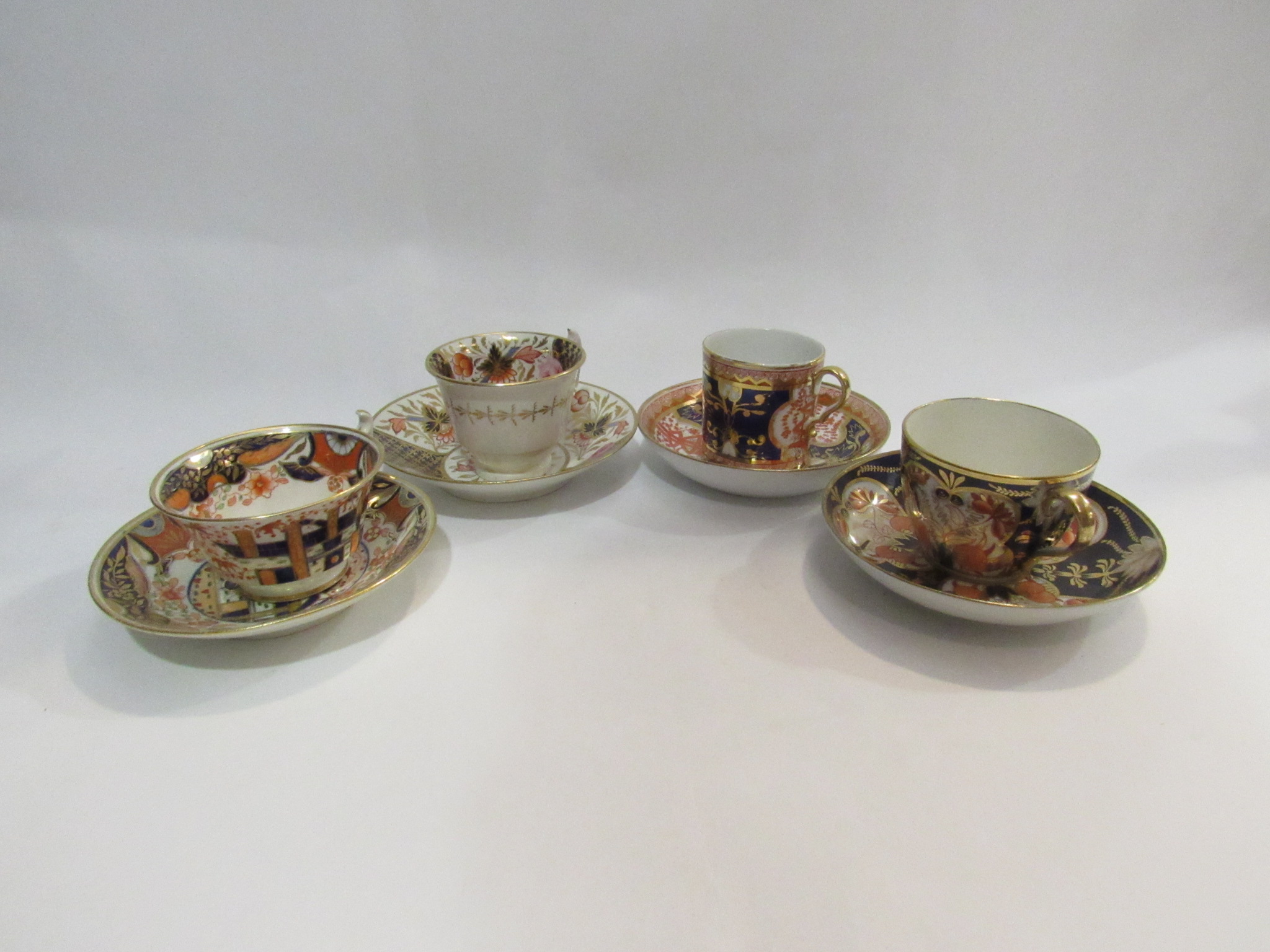 Four late 18th/early 19th Century cups and saucers in imari palette. - Image 2 of 2