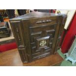 An 18th Century oak corner cupboard, geometric moulding, central bone inlay, 60cm tall,