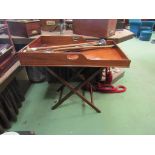 A 19th Century Country House mahogany butler's tray with fret handles on a folding stand