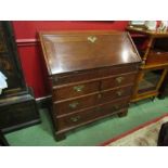 A mid 18th Century oak bureau, two short over two long drawers,