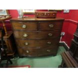 A 19th Century flame mahogany bow front chest of two short over three graduating long drawers on