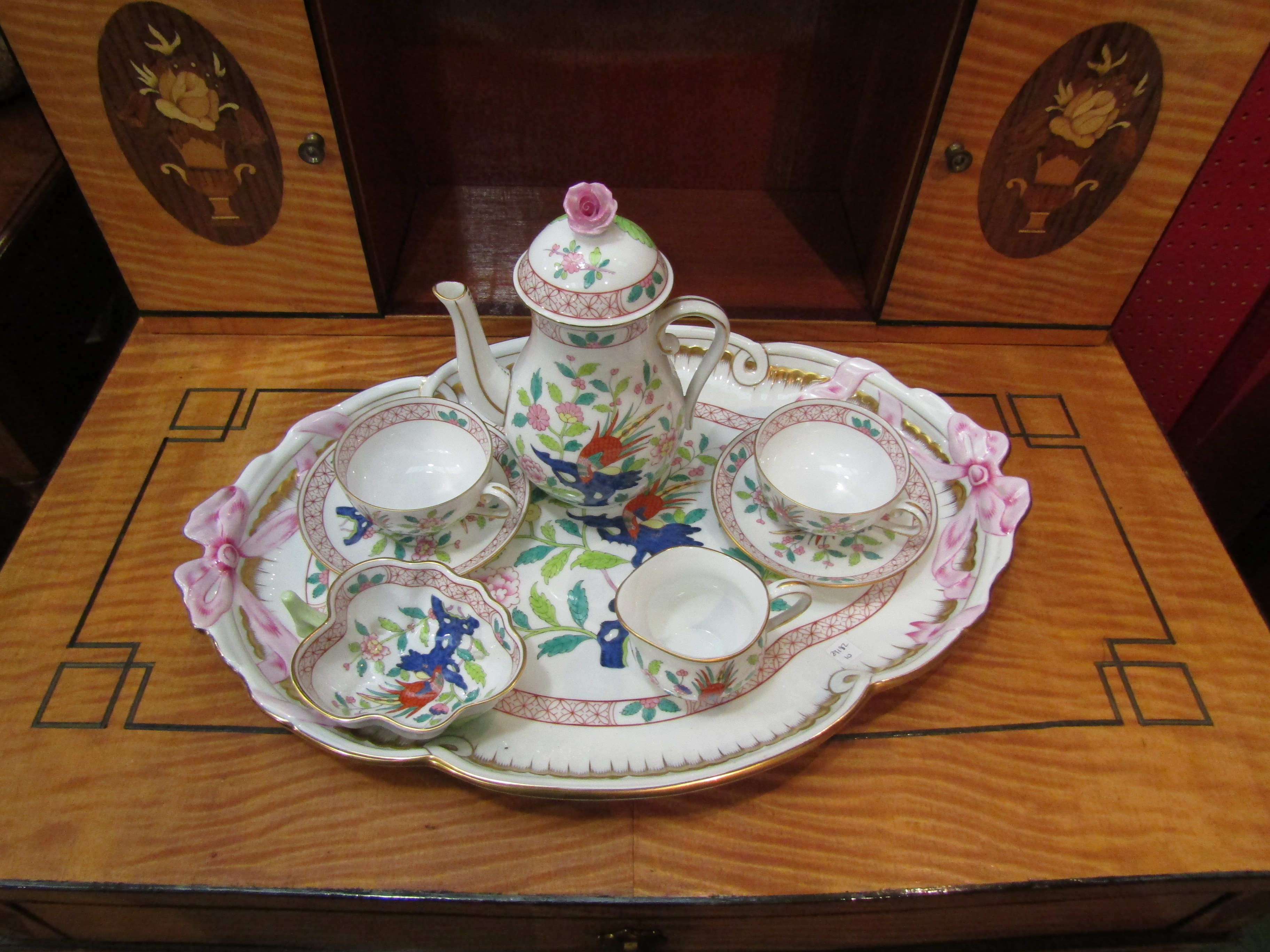 A Herend porcelain tea set for two consisting of teapot, pair of tea cups and saucers,