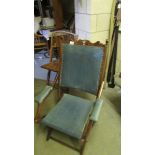 An Edwardian mahogany folding chair.