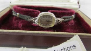 A Lady Elgin 14ct gold and diamond set wrist watch circa 1952, in original box.