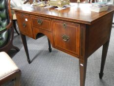 A mahogany writing desk.