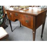 A mahogany writing desk.